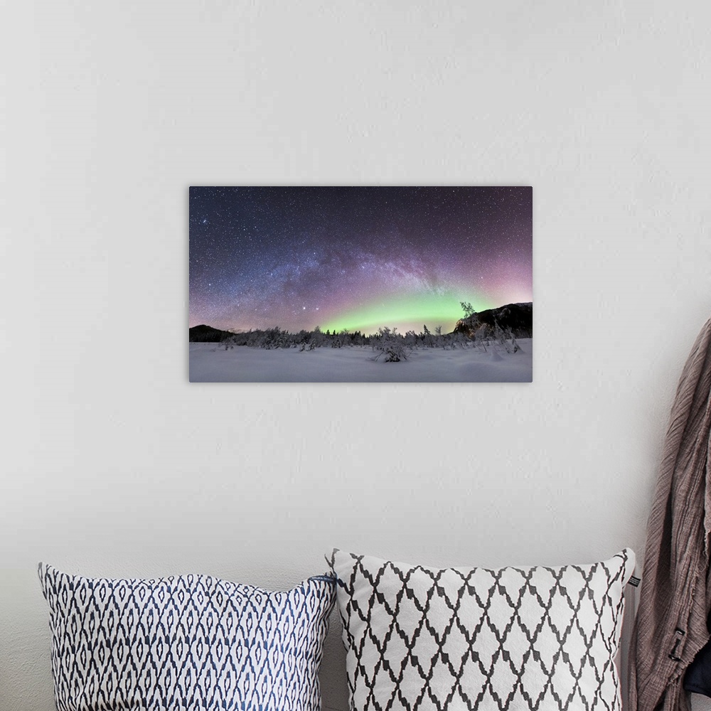 A bohemian room featuring Aurora borealis and Milky Way. View of the aurora borealis (northern lights) and the Milky Way ov...
