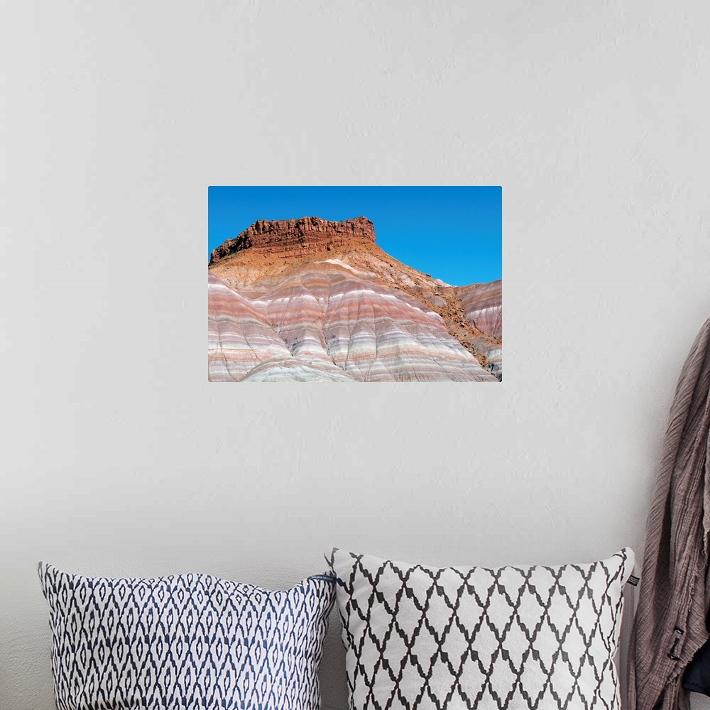 A bohemian room featuring Banded sandstone rock. Exposed layers of sandstone in a canyon. The varying colours of the rock i...