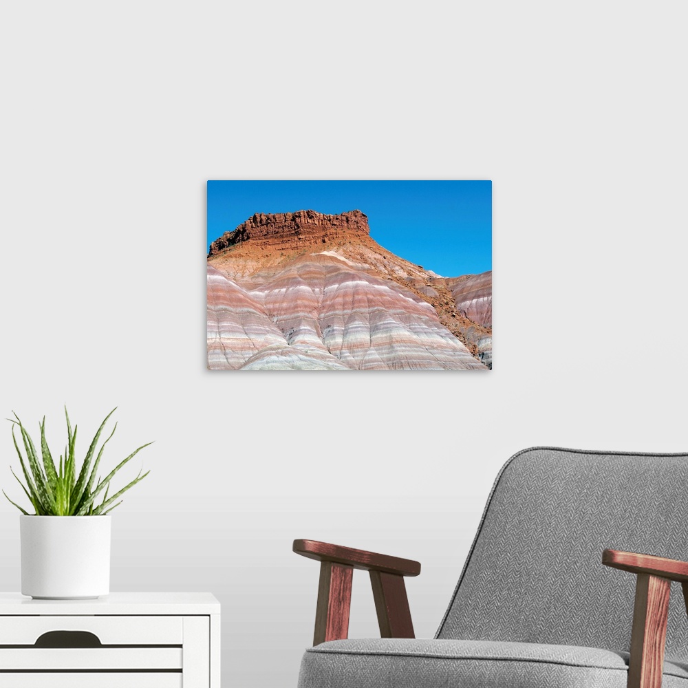 A modern room featuring Banded sandstone rock. Exposed layers of sandstone in a canyon. The varying colours of the rock i...