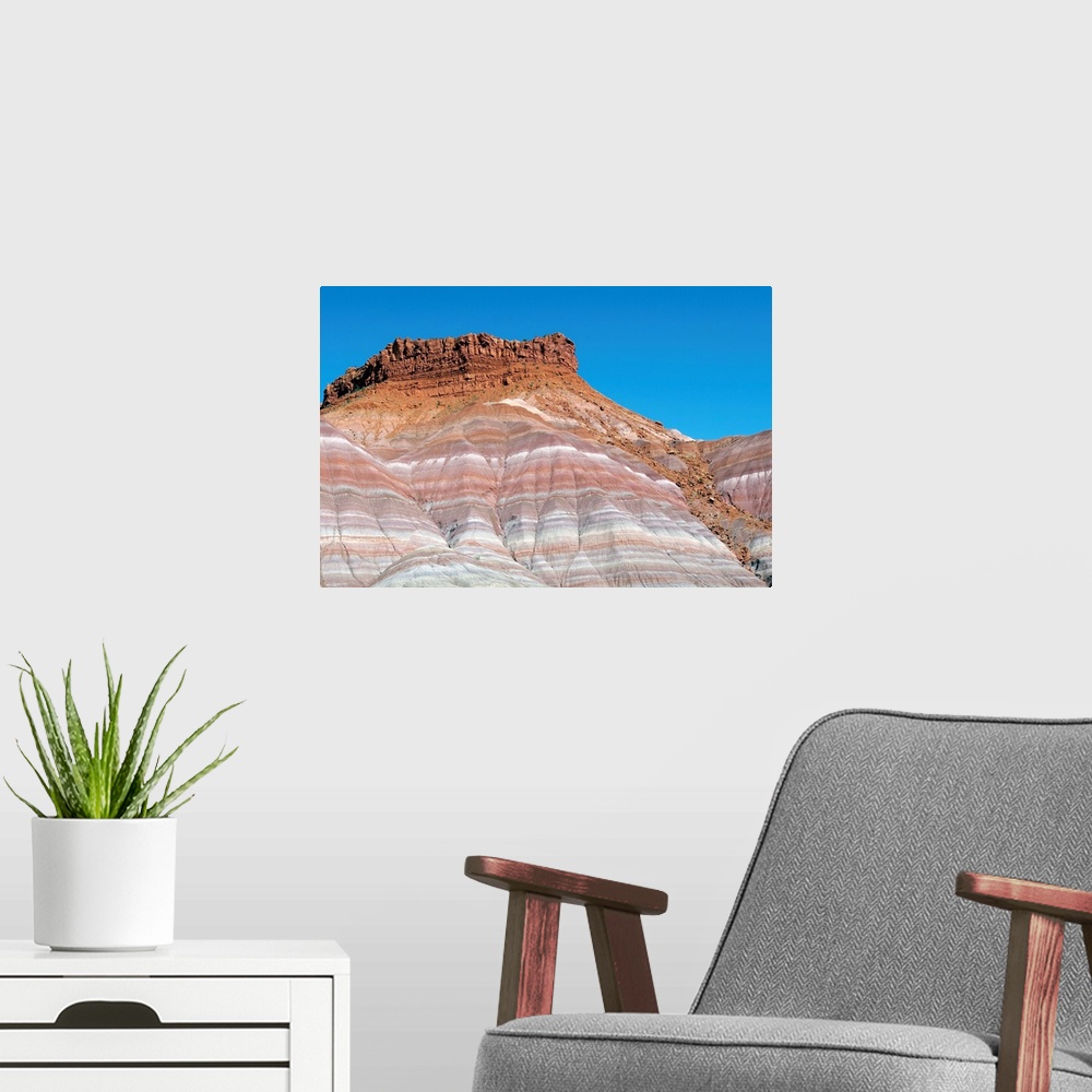 A modern room featuring Banded sandstone rock. Exposed layers of sandstone in a canyon. The varying colours of the rock i...