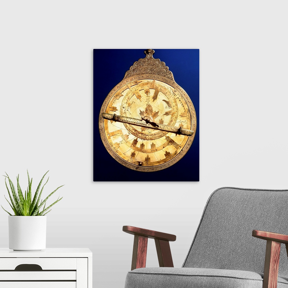 A modern room featuring Astrolabe. Brass astrolabe from the middle ages. The astrolabe consists of circles marked with an...