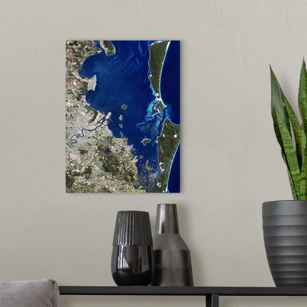 A modern room featuring Brisbane, Australia, satellite image. North is at top, water is blue, shallow coastal areas are l...