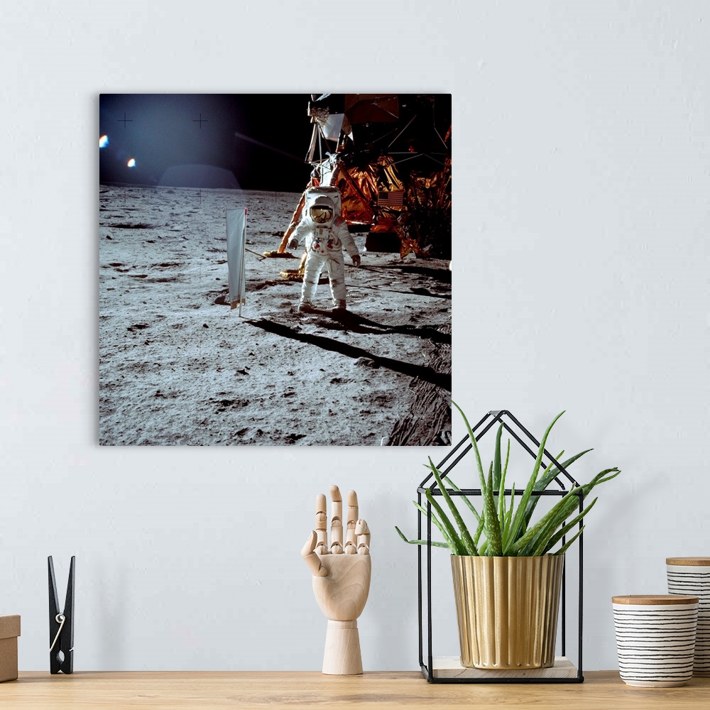A bohemian room featuring Apollo 11 astronaut Edwin \Buzz\" Aldrin walks on the surface of the Moon next to the lunar modul...