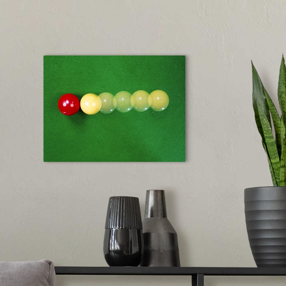 A modern room featuring Billiard balls colliding, demonstrating principles such as conservation of momentum, and Newton's...