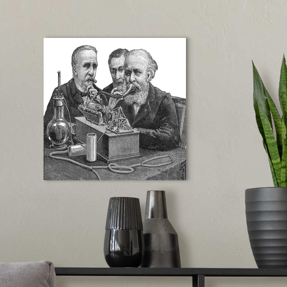 A modern room featuring Early telephone. Historical artwork of three men gathered around an early telephone. The man at r...