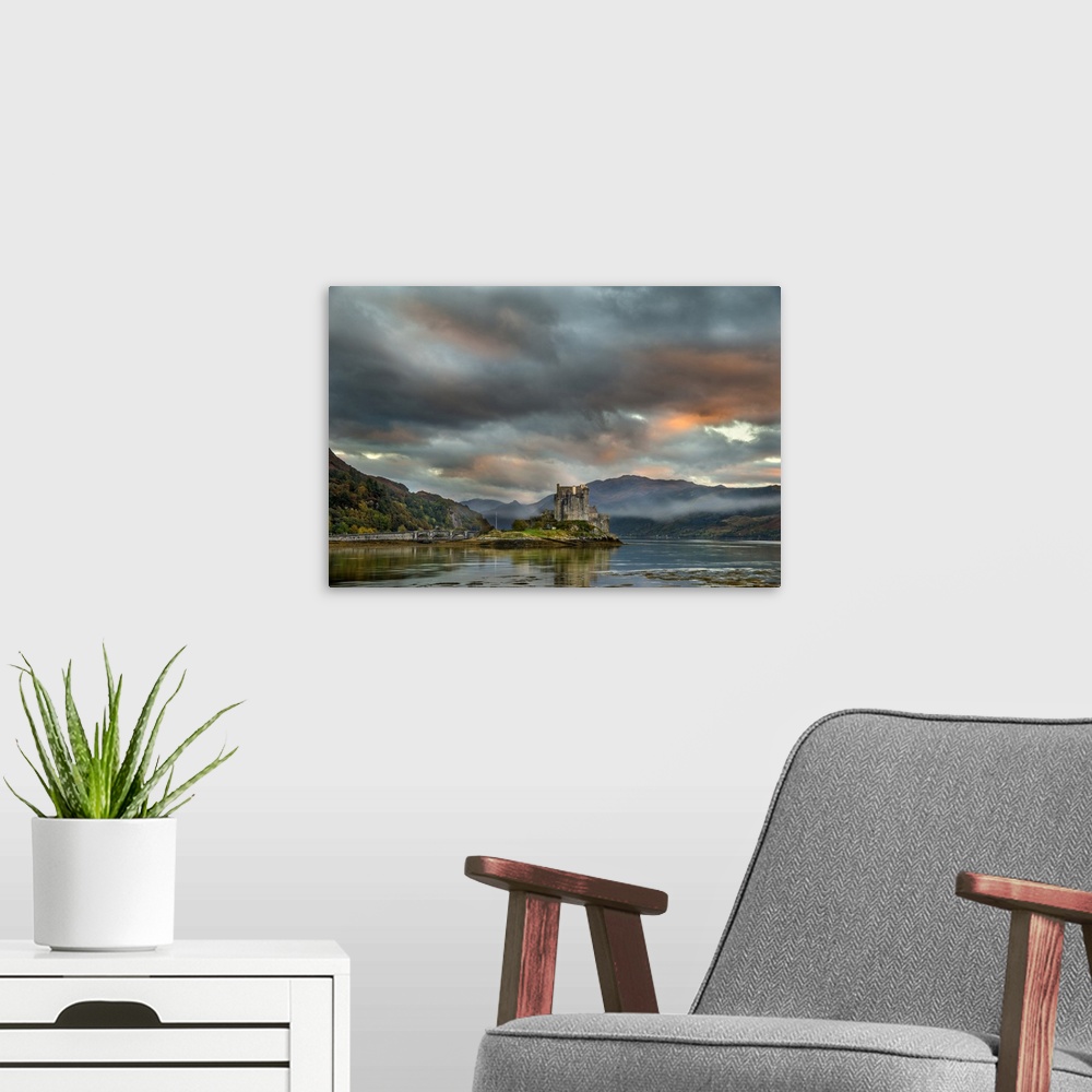 A modern room featuring Eilean Donan castle at dusk. This castle was built in the early thirteenth century. Photographed ...