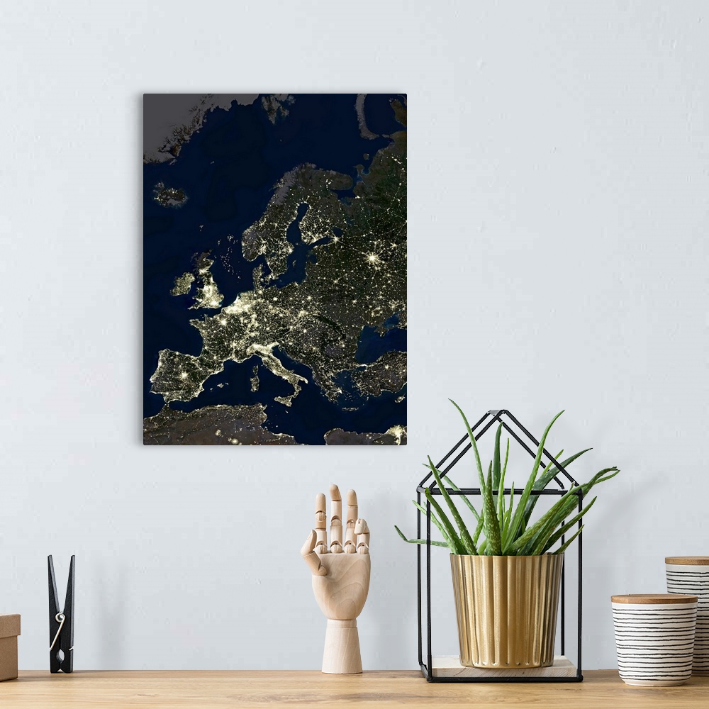 A bohemian room featuring Europe at night, satellite image. City lights (yellow) of increasing intensity show areas of incr...