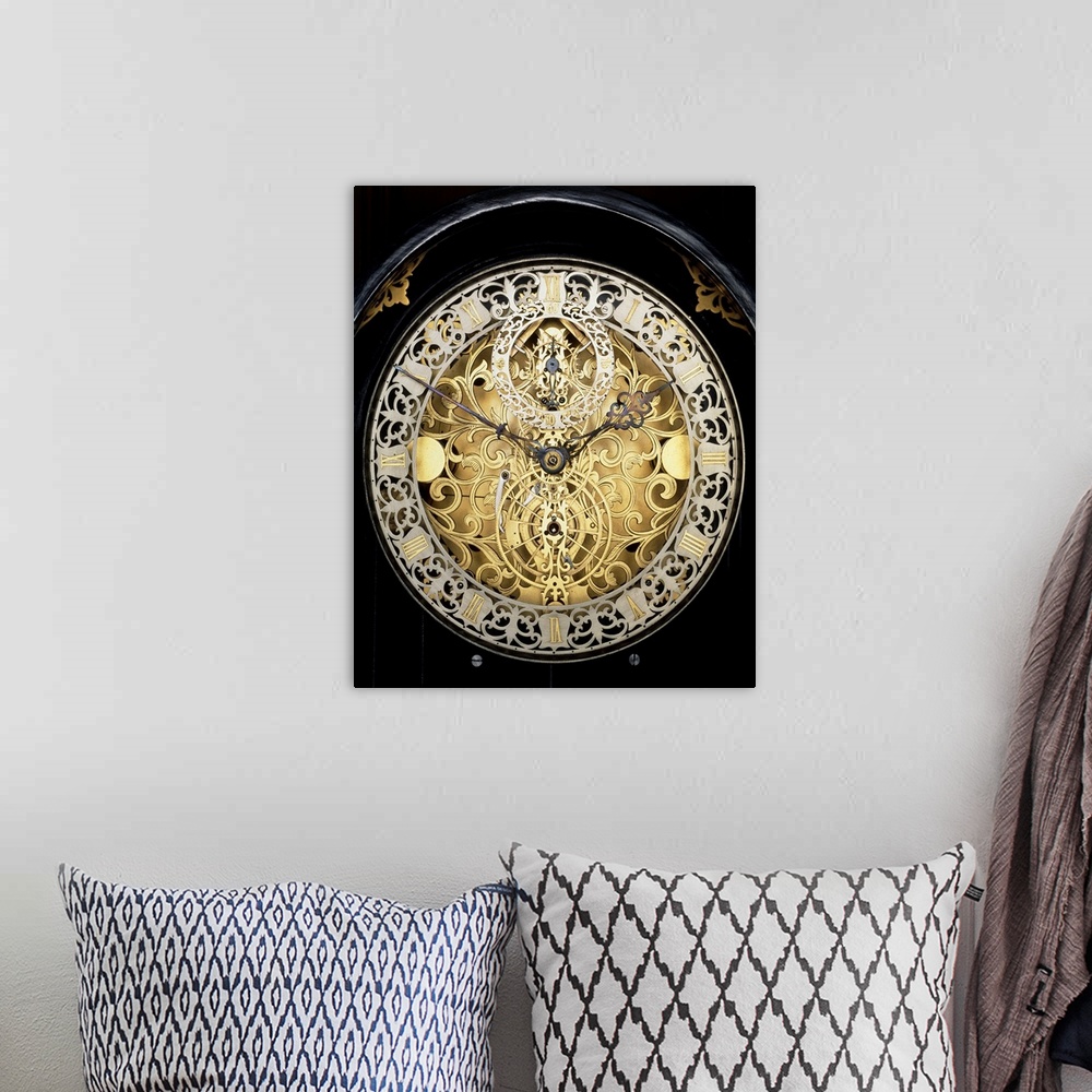 A bohemian room featuring Antique clock. Face of an antique skeleton clock, revealing the internal gearing. The main face s...