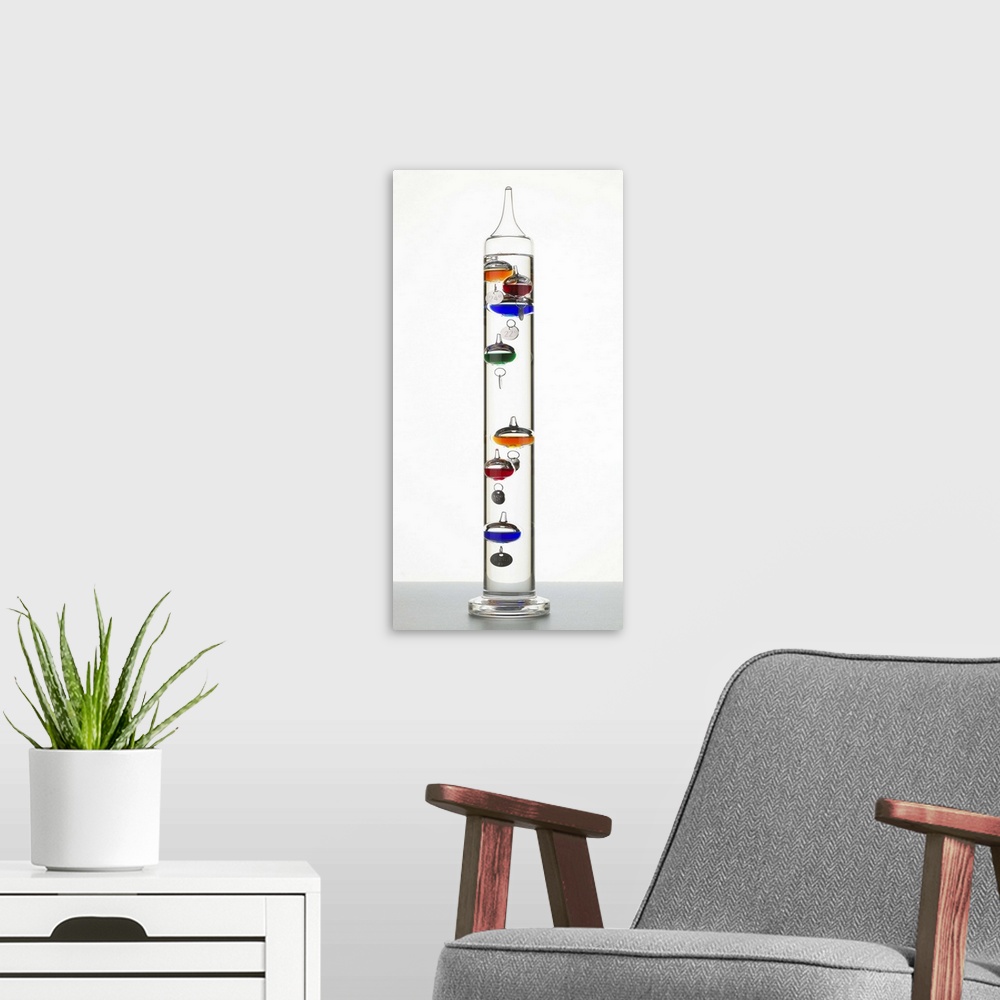 A modern room featuring Galileo thermometer.