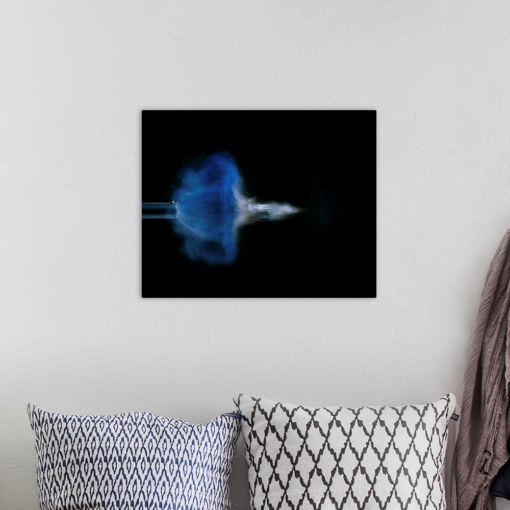 A bohemian room featuring High speed photograph of a 12 bore discharge, 4 milliseconds after detonation.