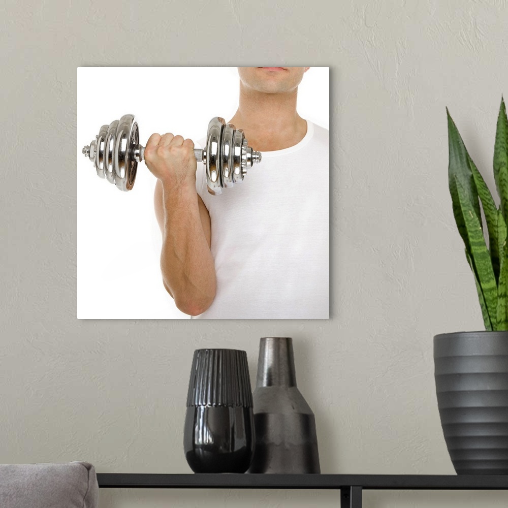 A modern room featuring MODEL RELEASED. Lifting weights.