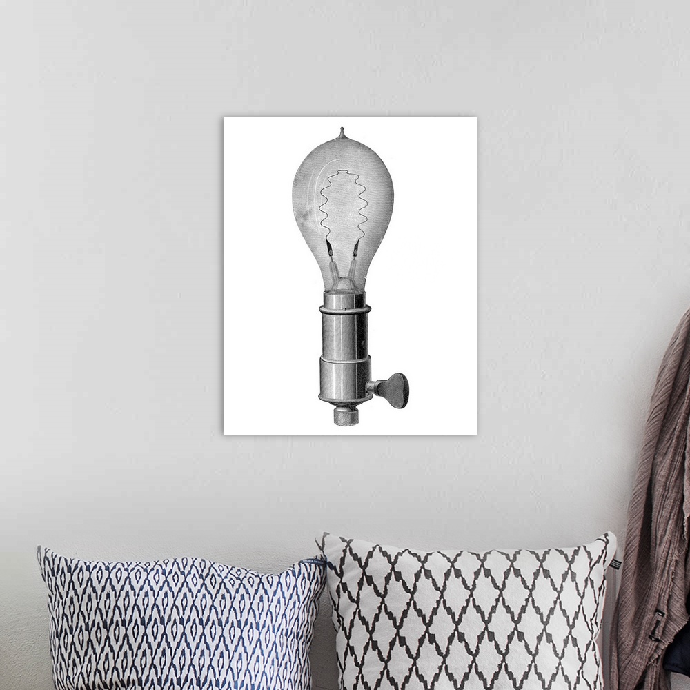 A bohemian room featuring Light bulb, historical artwork. This is an incandescent light bulb, using a metal filament throug...