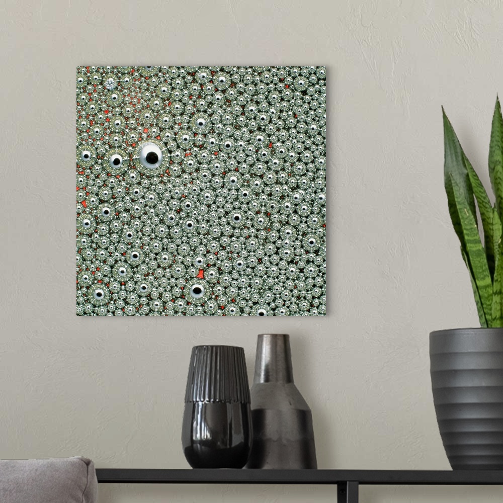A modern room featuring Macrophotograph of small droplets of mercury, which are suspended in oil to prevent them from fus...
