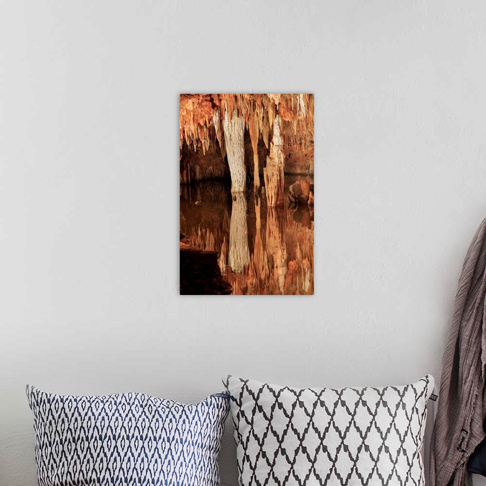 A bohemian room featuring Meramec Caverns. Limestone pillars, stalagtites and stalagmites by an underground stream. The Mer...