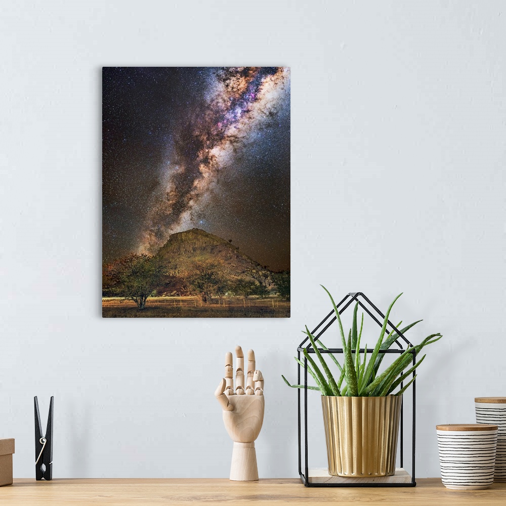 A bohemian room featuring Milky Way over a mountain, Namibia. The Milky Way is our galaxy seen from the inside, forming a b...