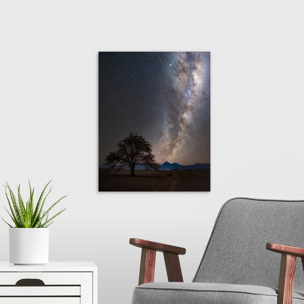 A modern room featuring Milky Way in the night sky over the desert village of San Pedro de Atacama, Chile. The galaxy is ...