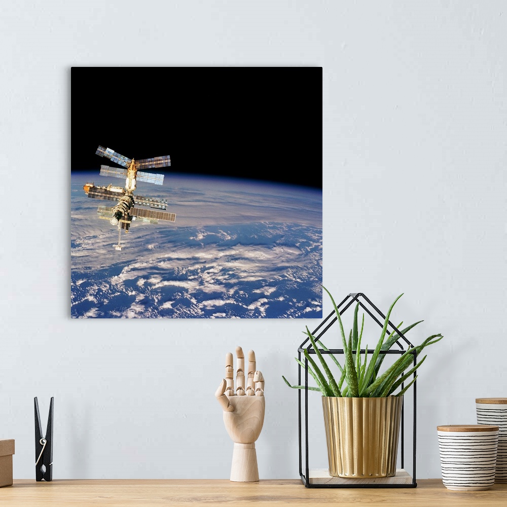 A bohemian room featuring Mir Space Station from Space Shuttle. Image taken from the aft flight deck of the Space Shuttle A...