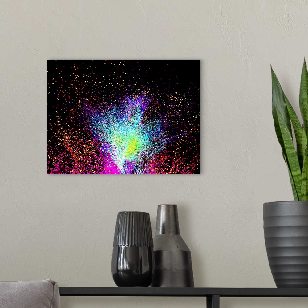 A modern room featuring Computer artwork of a particle burst or explosion.