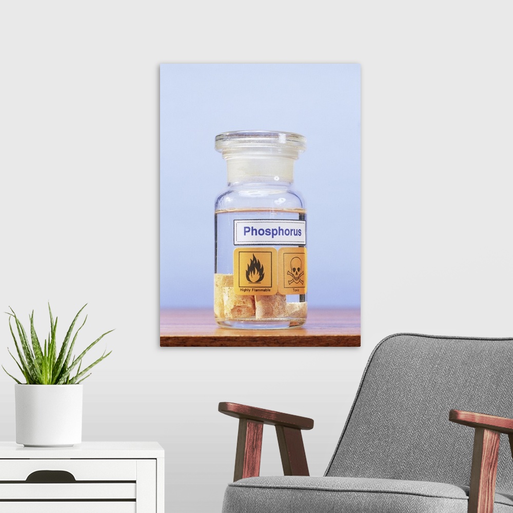 A modern room featuring Phosphorus stored under water in a glass jar. Phosphorus (chemical symbol P) is a non-metallic el...