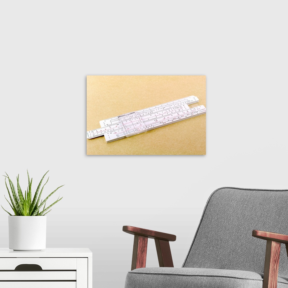 A modern room featuring Logarithmic slide rule. This adjustable ruler contains the values for logs, which are used to aid...