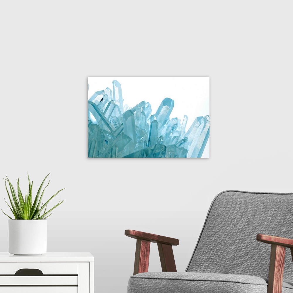 A modern room featuring Quartz crystals, photographed under blue light. Chemically silicon dioxide, quartz is one of the ...