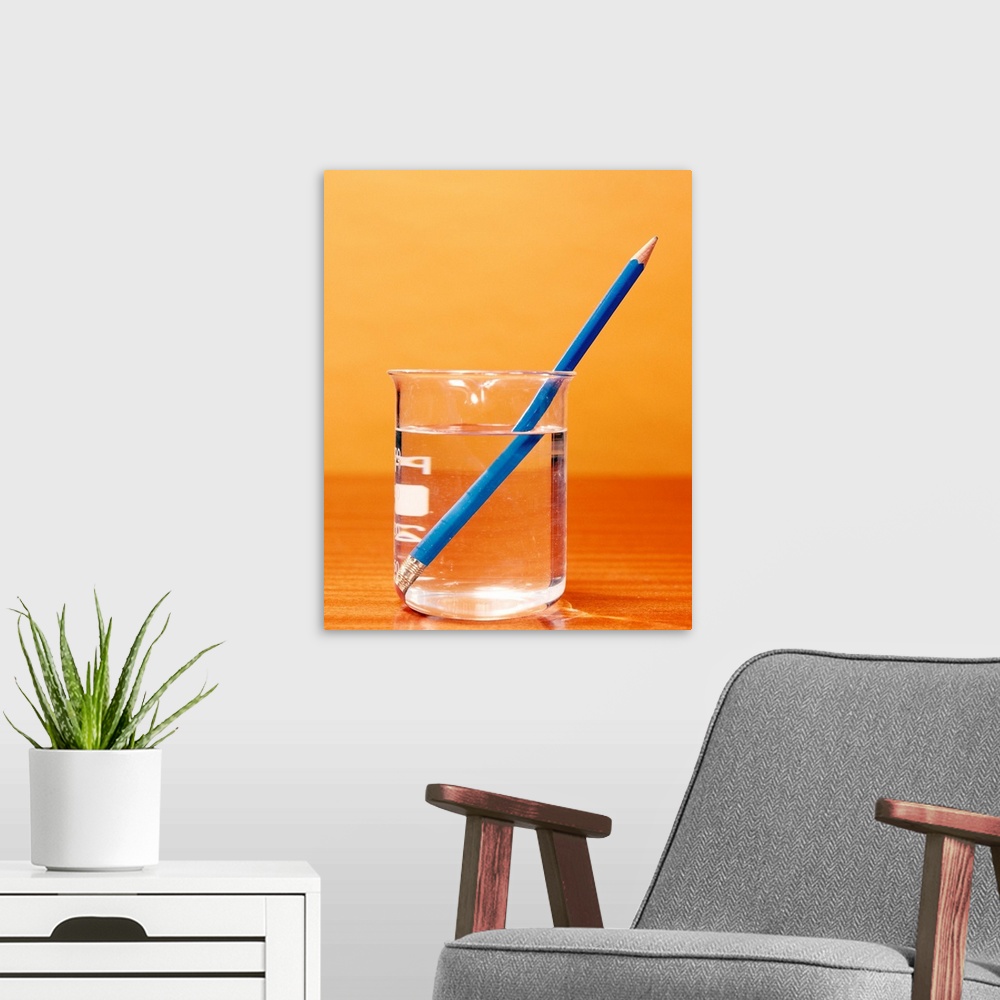 A modern room featuring Refraction of an image of a pencil in water. The pencil appears bent due to refraction (bending) ...