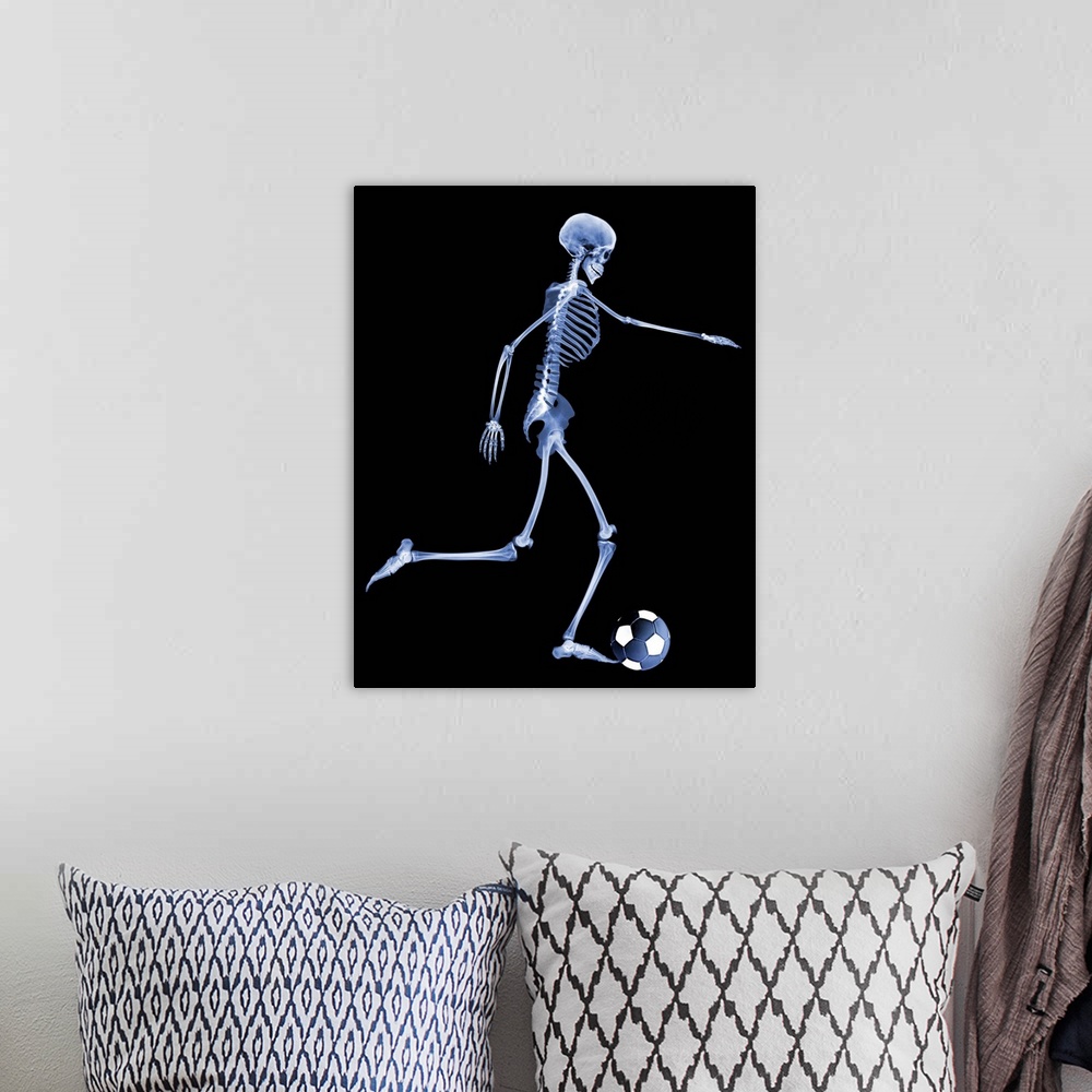 A bohemian room featuring Skeleton playing football. Computer enhanced X- ray of a skeleton kicking a football.