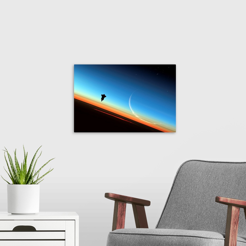 A modern room featuring Space shuttle above Earth's atmosphere, composite image.