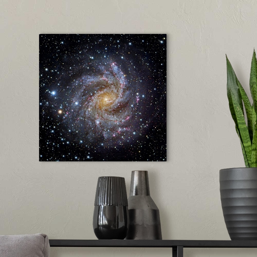 A modern room featuring Spiral galaxy NGC 6949, optical image. This galaxy is located between 10 and 20 million light yea...