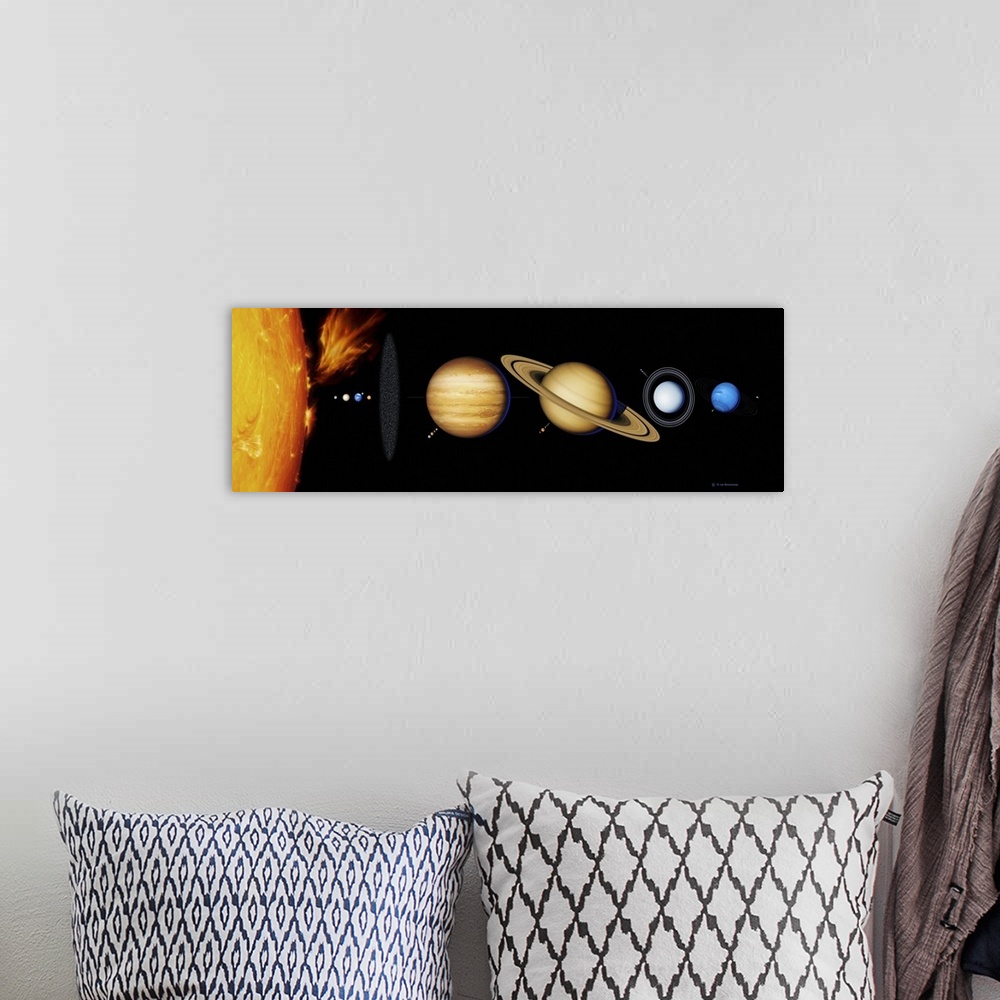 A bohemian room featuring Sun and its planets. Artwork of the nine planets of the solar system arrayed from left to right i...