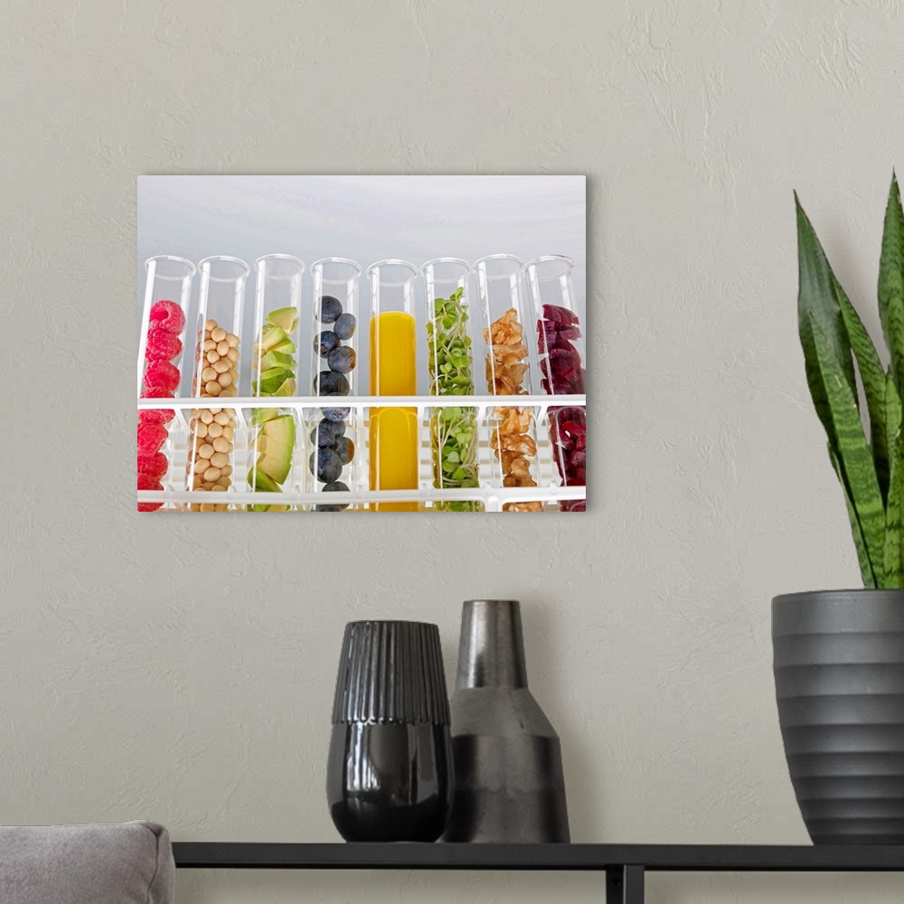 A modern room featuring Superfoods. Test tubes containing a variety of superfoods. From left to right are: raspberries, s...