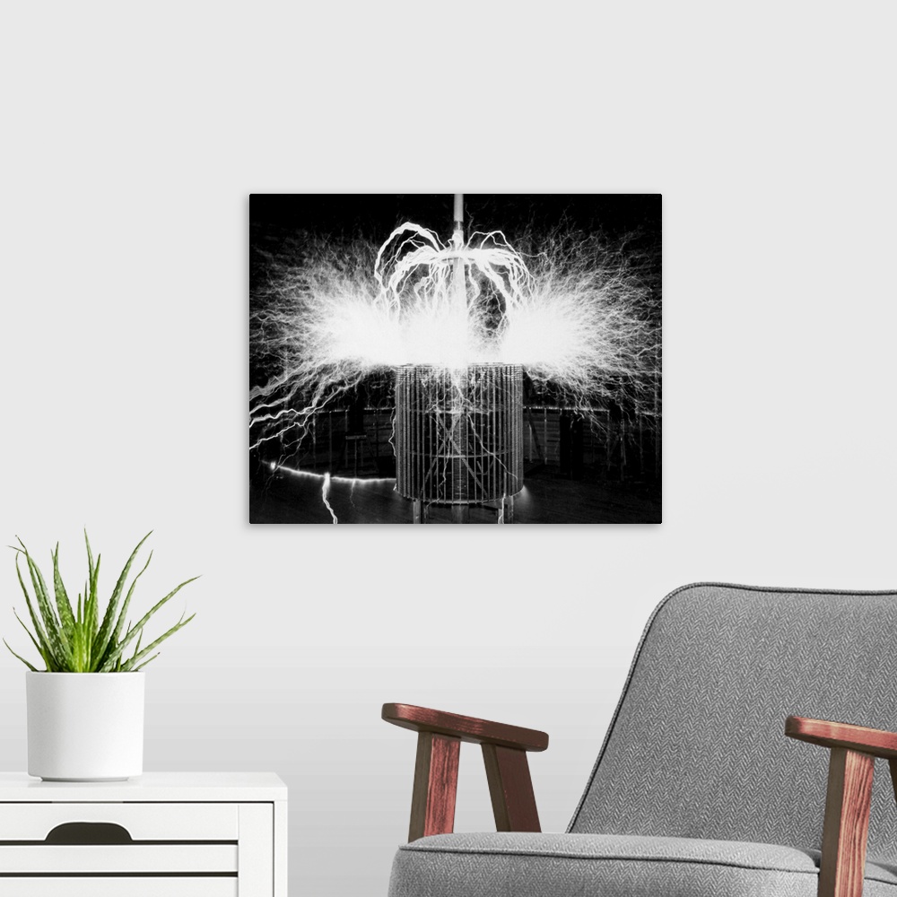 A modern room featuring Tesla coil experiment. Electrical streamers sparking outwards from a coil at the laboratory opera...
