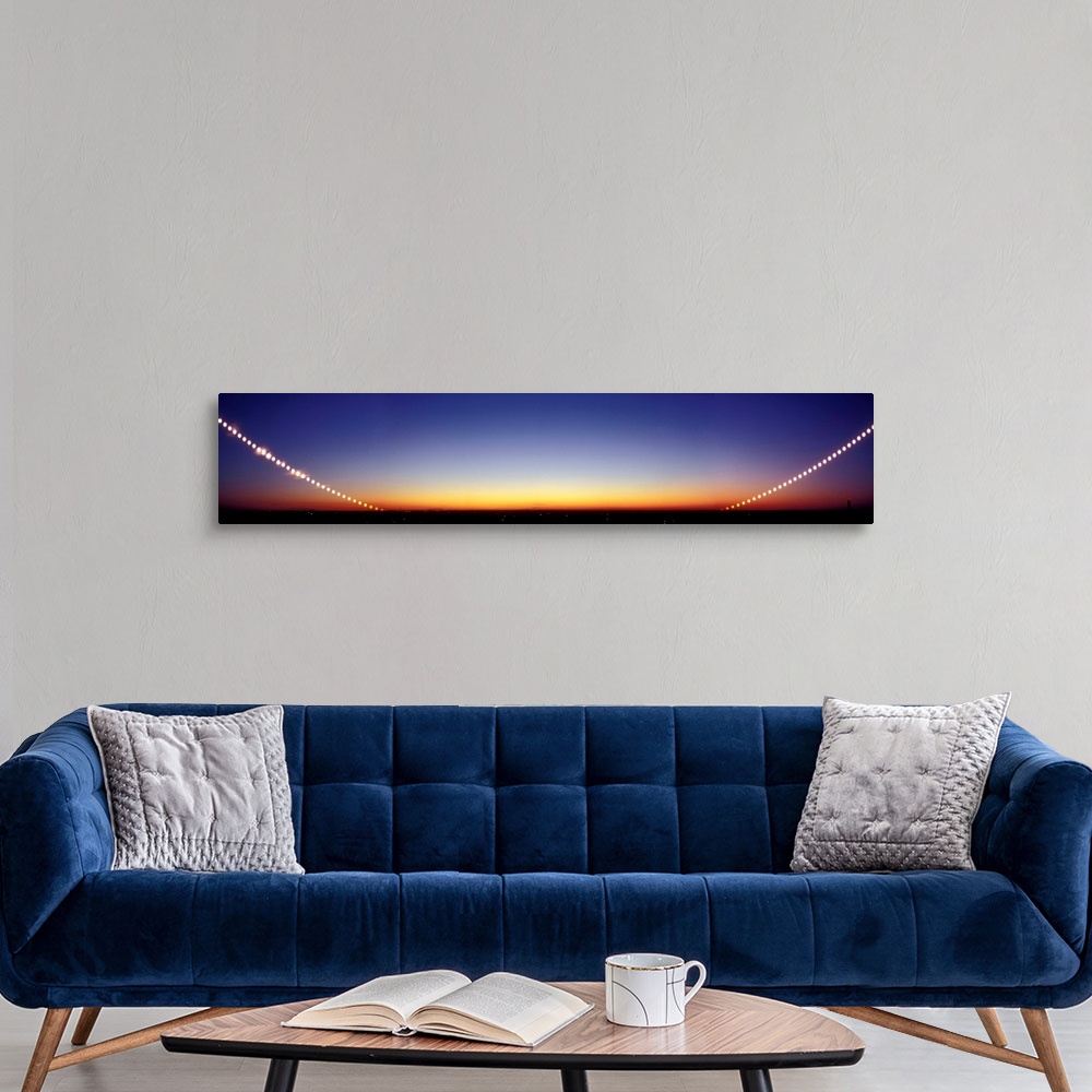 A modern room featuring Time-lapse image of a suntrail. Time-lapse exposure showing the path of the sun as it sets below ...