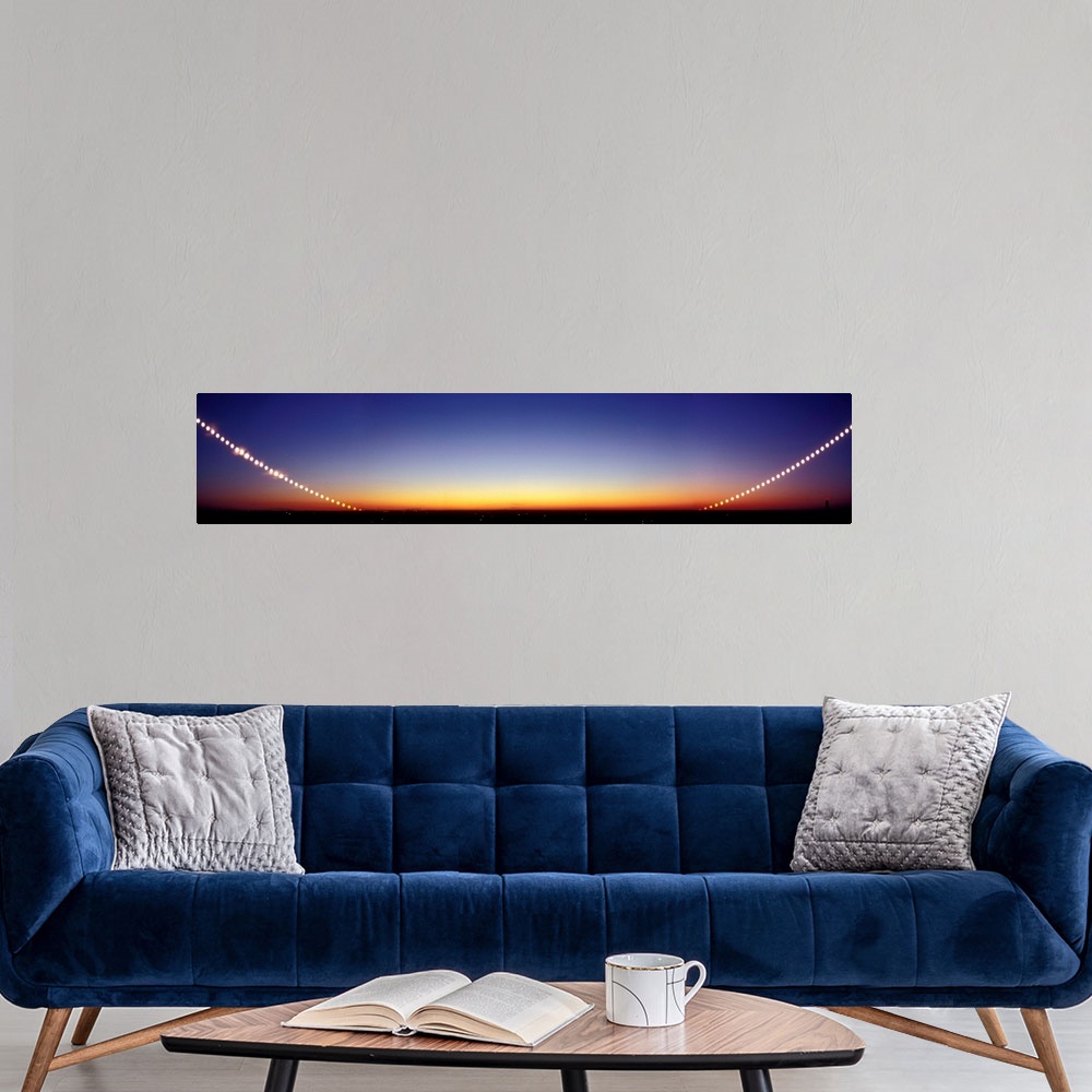 A modern room featuring Time-lapse image of a suntrail. Time-lapse exposure showing the path of the sun as it sets below ...