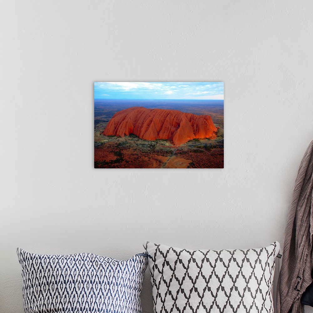 A bohemian room featuring Uluru (Ayers Rock) at sunset. Uluru is a large sandstone rock formation in the southern part of t...