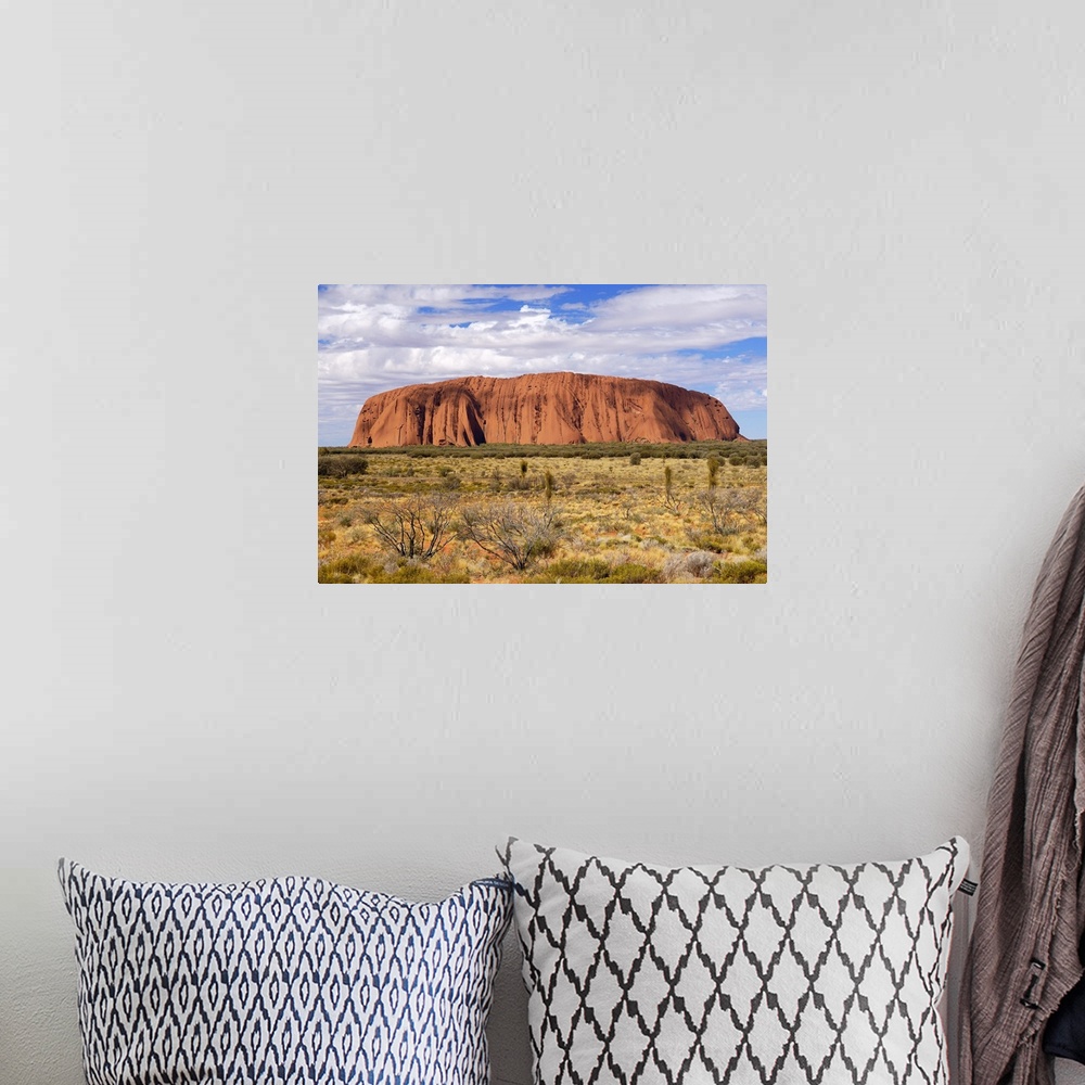 A bohemian room featuring Uluru (Ayers Rock) in the morning. Uluru is a large sandstone rock formation in the southern part...