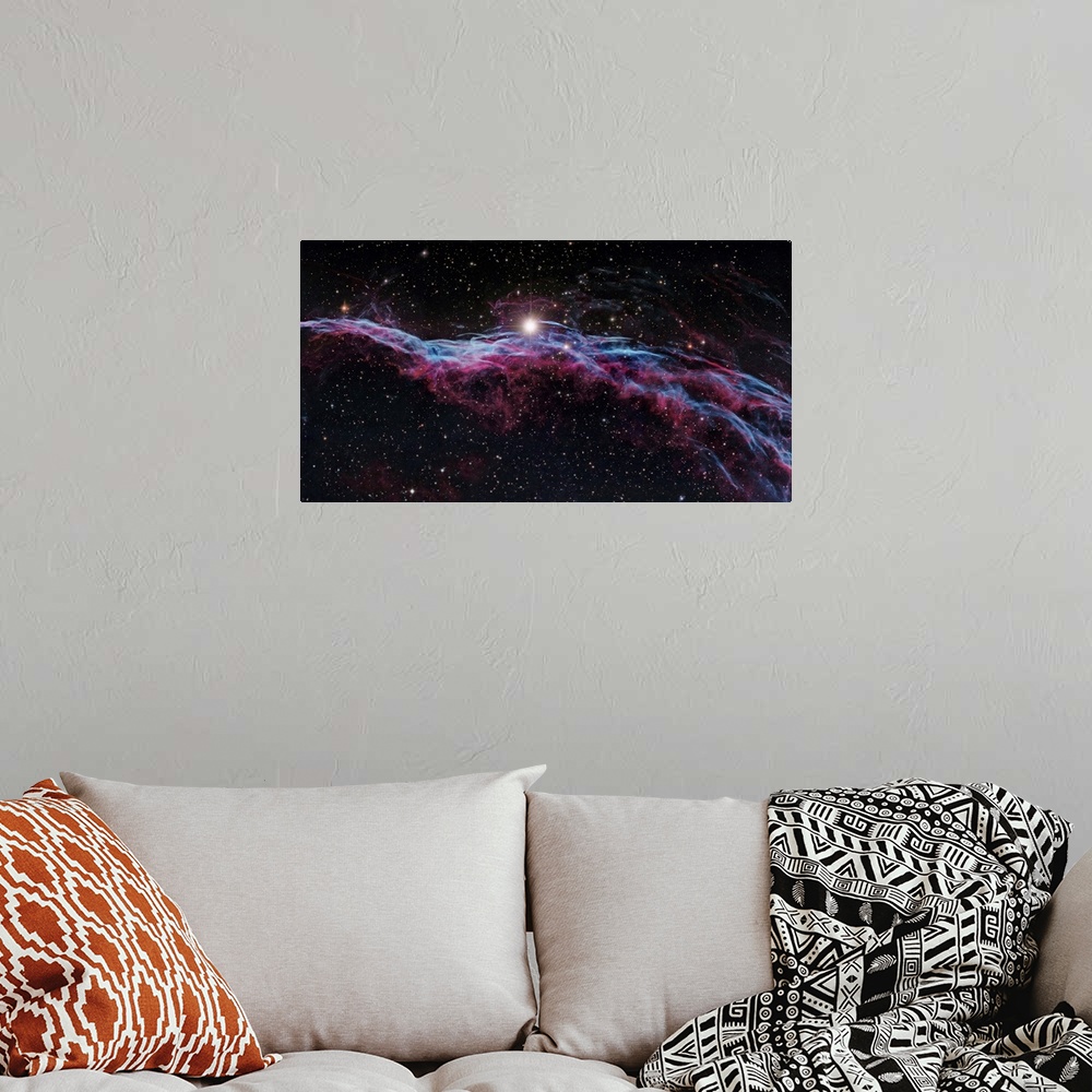A bohemian room featuring Veil Nebula (IC 1340), optical image. The Veil Nebula is a cloud of heated and ionized gas and du...