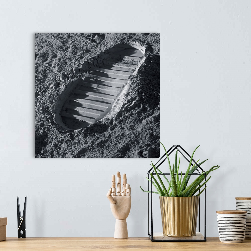 A bohemian room featuring Walking on the Moon. Computer illustration of an astronaut's bootprint on the surface of the Moon.