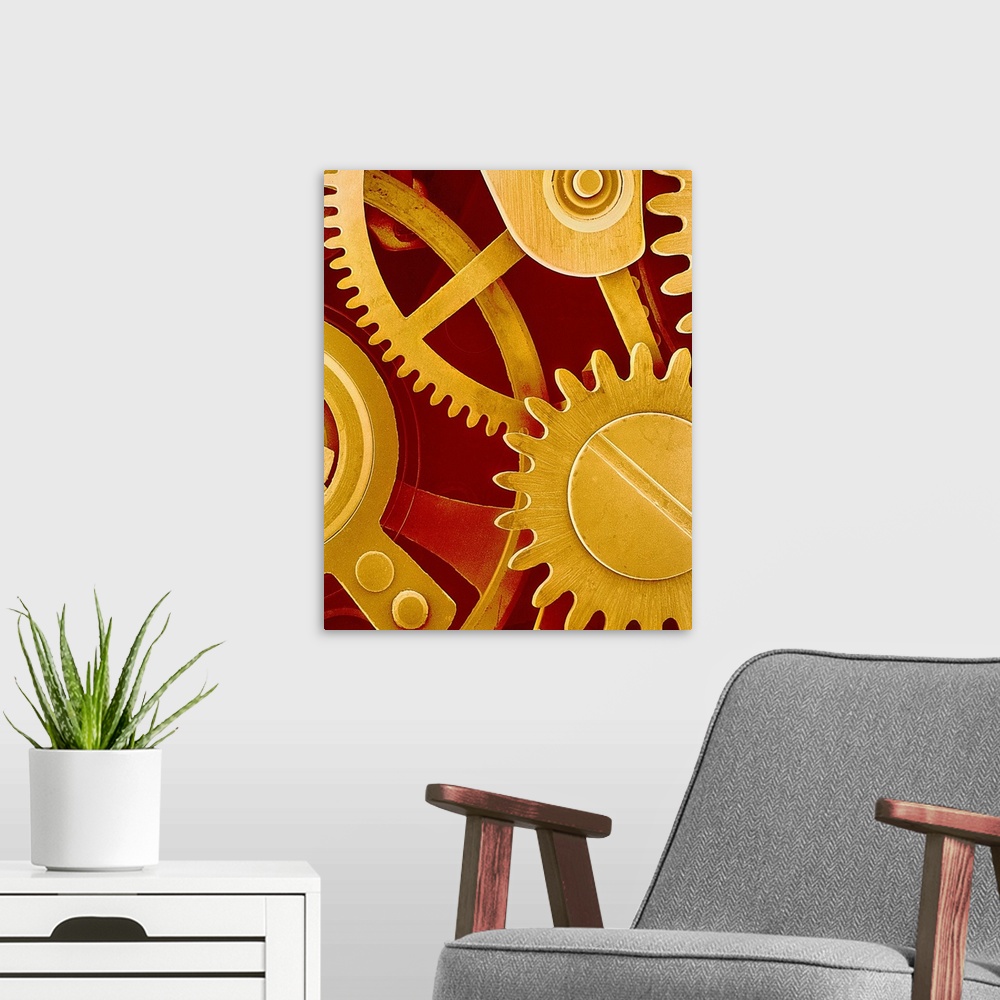 A modern room featuring Watch gears. Coloured scanning electron micrograph (SEM) of the internal mechanism of a wristwatc...