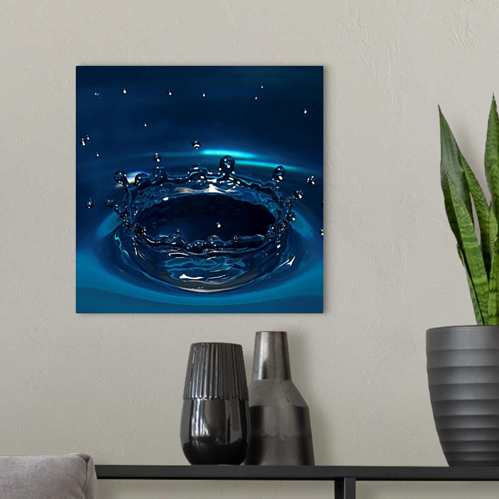 A modern room featuring Water drop impact on water surface.