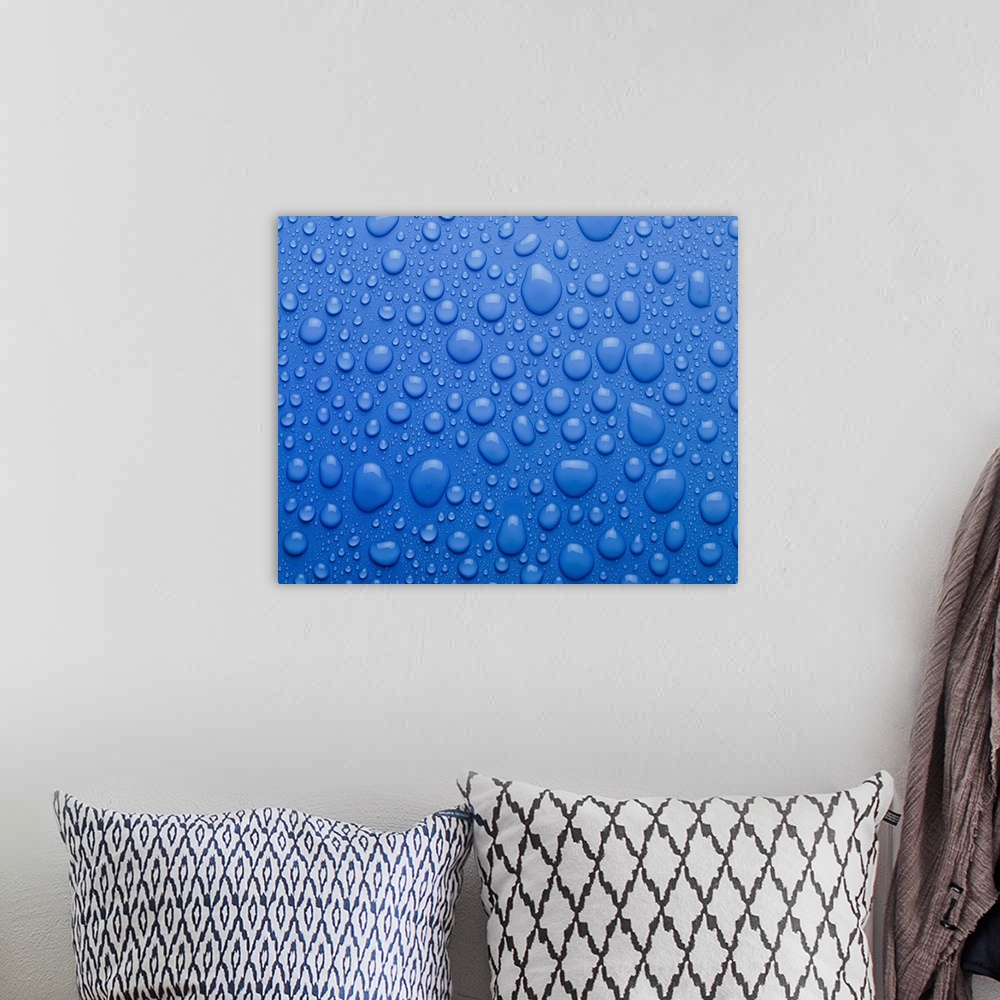 A bohemian room featuring Water droplets as condensation on a flat surface.