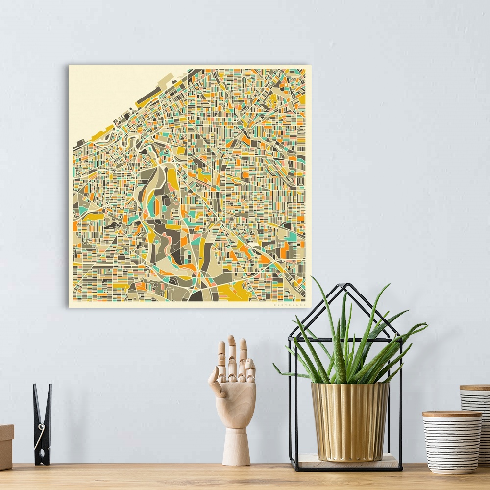 A bohemian room featuring Colorfully illustrated aerial street map of Cleveland, Ohio on a square background.