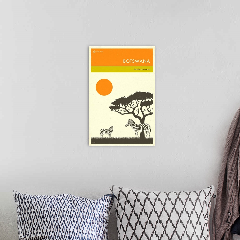 A bohemian room featuring Minimalist retro style Visit Africa travel poster for Botswana.