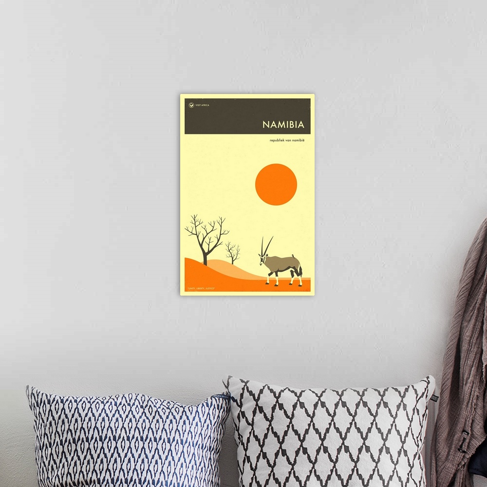A bohemian room featuring Minimalist retro style Visit Africa travel poster for Namibia.