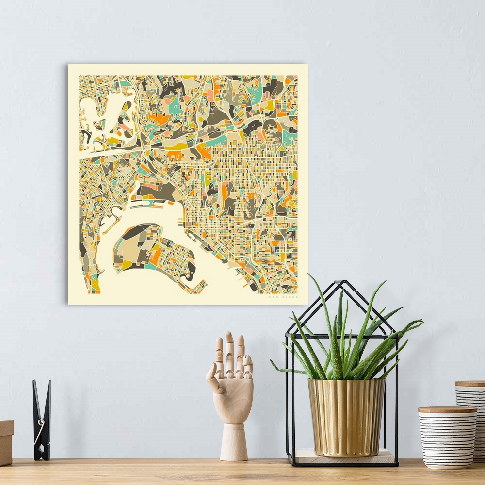 A bohemian room featuring Colorfully illustrated aerial street map of San Diego, California on a square background.
