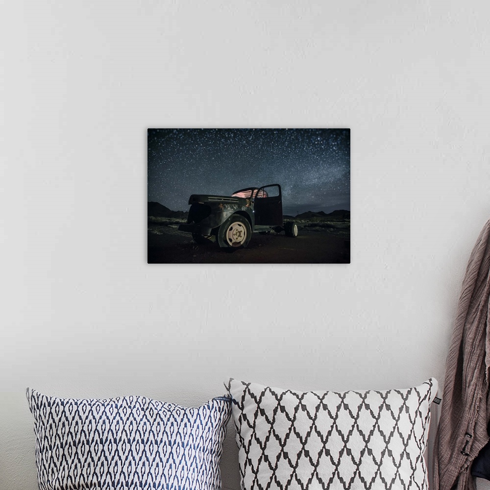 A bohemian room featuring Abandoned old truck with the stars and the night sky