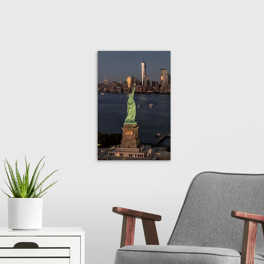 A modern room featuring Aerial view of Stature of Liberty and New York City from above