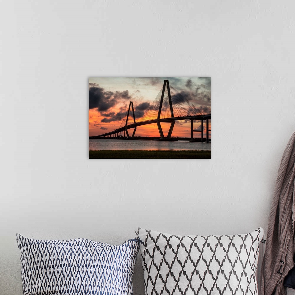 A bohemian room featuring Arthur Ravenel Jr. Bridge crossing the Cooper River at sunset.