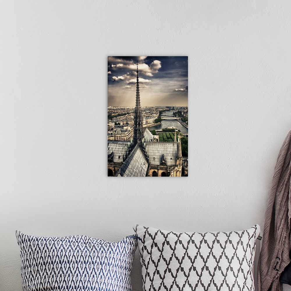 A bohemian room featuring Fine art photograph of the top spire of the cathedral, overlooking the Seine river and the Ile-de...