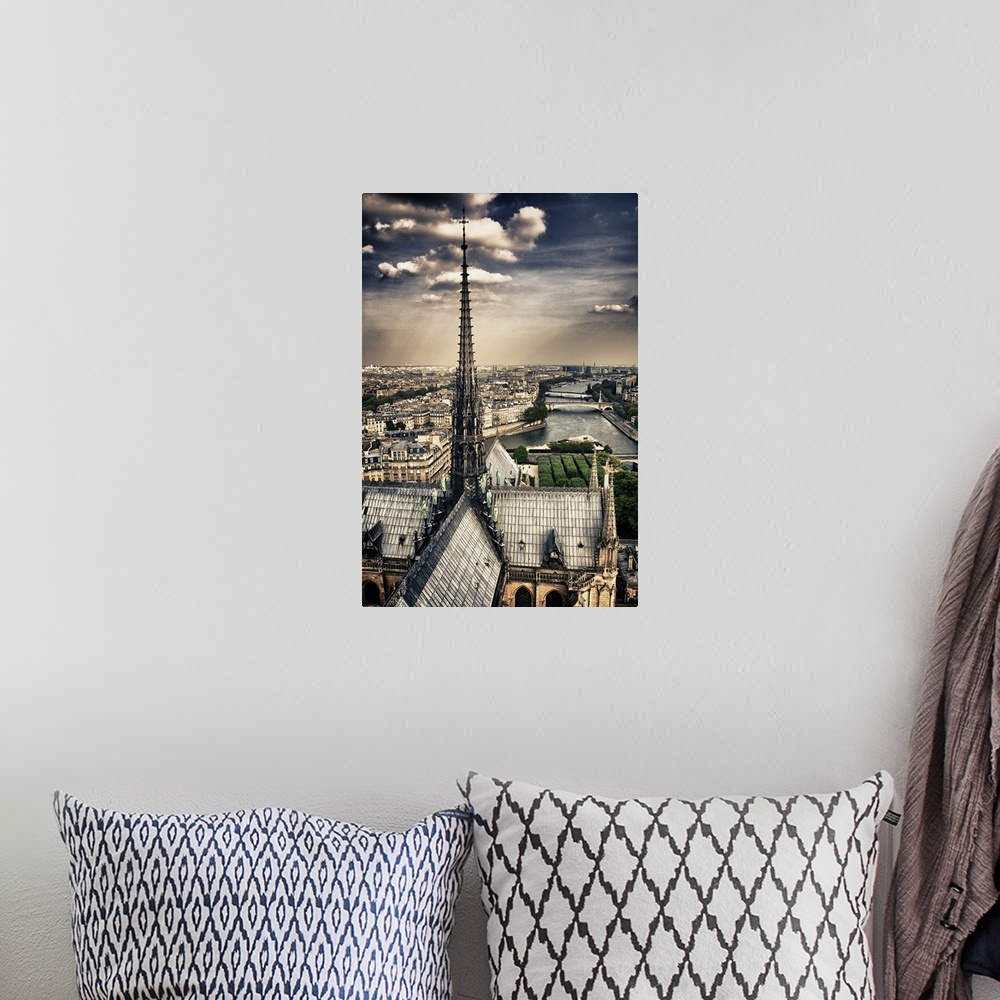 A bohemian room featuring Fine art photograph of the top spire of the cathedral, overlooking the Seine river and the Ile-de...